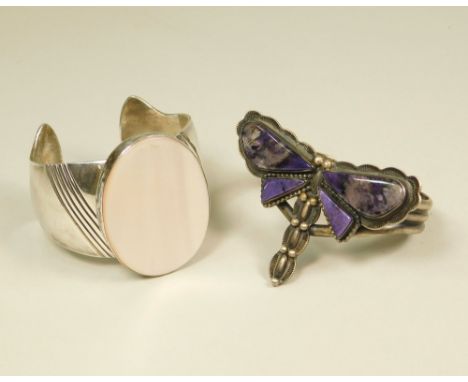 CUFF BANGLES. An oxidised &amp; hardstone set dragonfly cuff bangle, width 7.5cm &amp; one other hand made mother of pearl ba