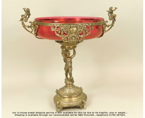 WMF. A WMF silver plated table centre, the detachable top with original cranberry glass liner. Diameter 27cm. Height 36cm.