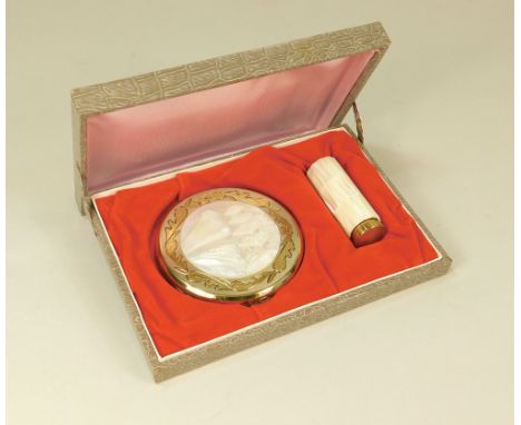 POWDER COMPACT ETC.A gold tone & carved mother of pearl powder compact & matching lipstick in presentation case.