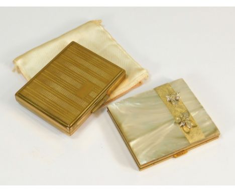 POWDER COMPACTS.An American gold tone powder compact by Marhill, the lid with paste set butterflies (with original labels & s
