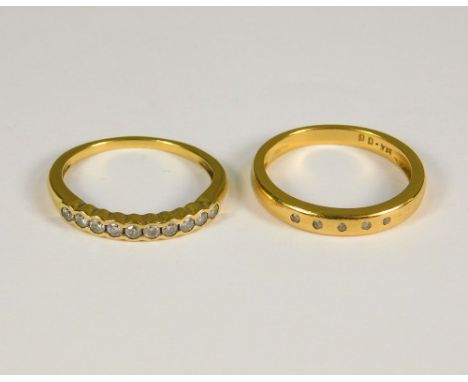 GOLD RINGS. A contemporary 18ct. gold, ten stone diamond ring &amp; one other contemporary 18ct. gold diamond ring. Total wei