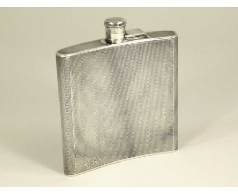 SPIRIT FLASK. A curved engine turned spirit flask. Birmingham 1936. Height 10.5cm. Approx. 125g. 4.3oz.