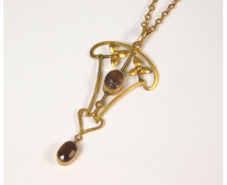AMETHYST PENDANT. An Edwardian amethyst pendant on 9ct. rose gold chain.