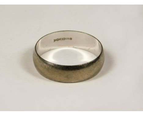 GOLD RING. A 9ct. white gold wedding band. Approx. 3.6g. (U).