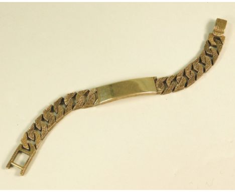 IDENTITY BRACELET. A 9ct. gold identity bracelet with textured strap. Approx. 80g.