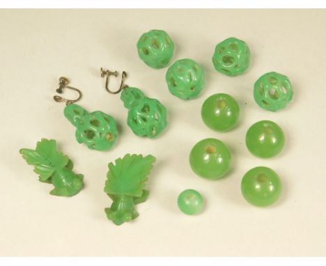 GLASS EARRINGS.Two pairs of pierced jade glass earrings, other pierced & solid jade-coloured beads & a pair of carved fish. (
