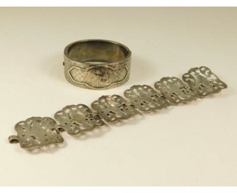BRACELETS. A Victorian engraved cuff bangle &amp; an EPNS bracelet.
