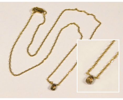 DIAMOND PENDANT. An 18ct. gold chain, hung a pear-drop brown diamond. Approx. 2.8g. Diamond length 50mm.