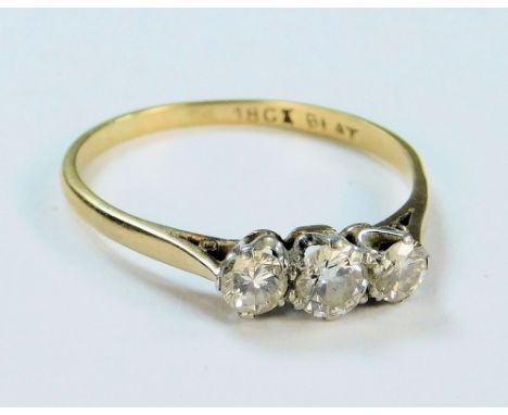 DIAMOND RING. An 18ct. gold &amp; platinum three stone diamond ring, in coronet setting. (U).