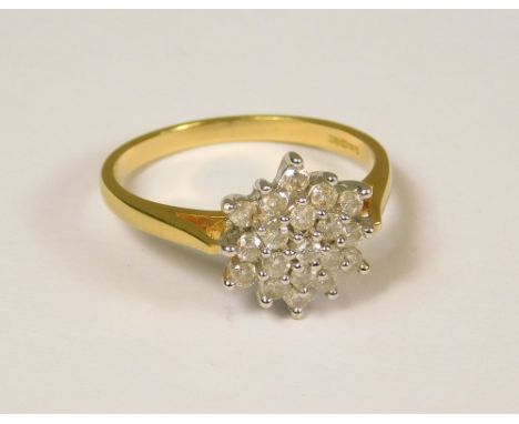 DIAMOND RING. An 18ct. gold diamond flower head cluster ring. Total diamond approx. 0.50ct. (P/Q).