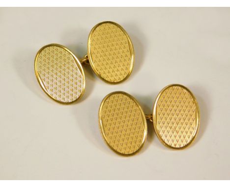 GOLD CUFFLINKS. A pair of 9t. gold engine turned cufflinks. 14.9g.