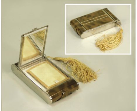 MINAUDERIE.A 1950's chrome & mottled enamel minauderie, incorporating a powder compact, a cigarette case & a tasseled lipstic