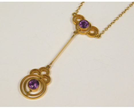 AMETHYST PENDANT. An Edwardian 9ct. gold amethyst pendant &amp; chain.