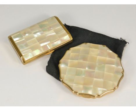 POWDER COMPACTS. A Melissa gold tone musical powder compact with photograph aperture. Also, a round Stratton powder compact, 