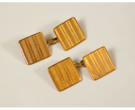 GOLD CUFFLINKS. A pair of 9ct. gold engine turned cufflinks. 7.1g.
