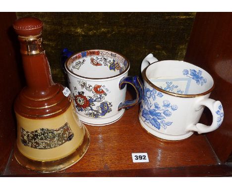 A Wade Bells Old Scotch Whisky decanter and a Wade two handled quart cider mug, limited edition replica of one in the Taunton