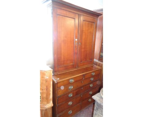 Georgian oak 2-door cupboard on chest of two small drawers and four graduated drawers standing on ogee bracket feet, 43" wide