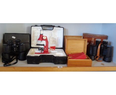 Two pairs of modern binoculars, a microscope and some tools