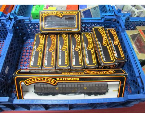 Eight 'OO' Scale Model Railway Four Wheel Wagons, an Eight Wheel Box Car. All by Mainline/Boxed.