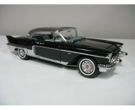 A Boxed Franklin Mint 1:24th Scale Die Cast 1957 Cadillac Eldorado Brougham, highly detailed model in black with brushed stee