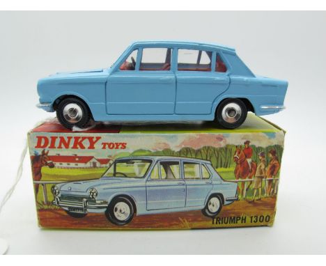 A Boxed Original Dinky #162 Triumph 1300, light blue body, red interior, spun hubs, jeweled headlamps. Model is mint, box goo