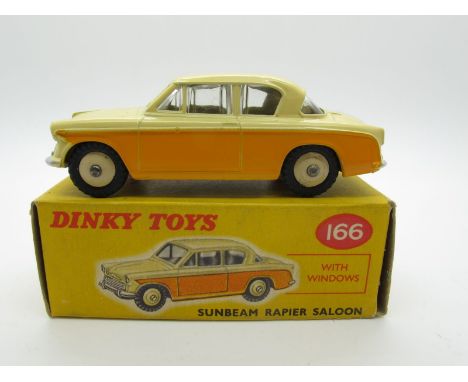 A Boxed Original Dinky #166 Sunbeam Rapier Saloon, yellow lower body, deep cream upper, beige hubs. Model near mint with smal