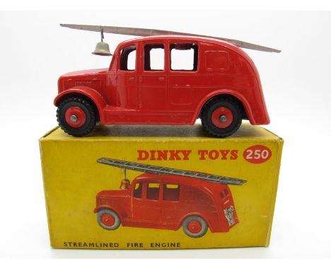 A Boxed Original Dinky #250 Streamlined Fire Engine,  red body and hubs, silver tinplate ladder, bell and trim. Model is near