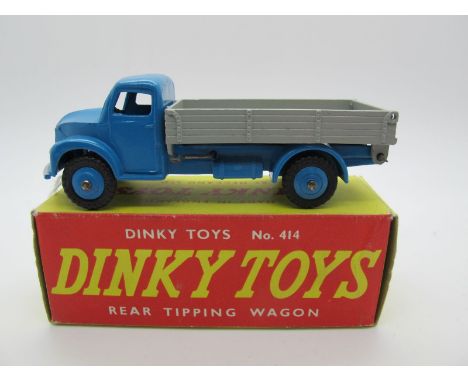 A Boxed Original Dinky #414 Dodge Rear Tipping Wagon, mid blue cab and hubs, grey back, silver details. Model is near mint wi