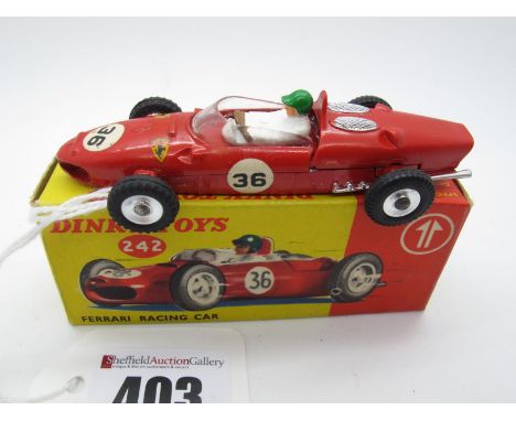 A Boxed Original Dinky #242 Ferrari Racing Car, red body, removable engine cowl, spun hubs, green helmet, R.N.36. Model very 