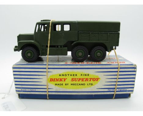 A Boxed Original Dinky #689 Medium Artillery Tractor, olive drab body, driver in, six wheels, tin tilt, olive drab hubs. Mode