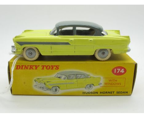 A Boxed Original Dinky #174 Hudson Hornet Sedan,  yellow lower body, grey roof and flash, light grey hubs, white tyres, silve