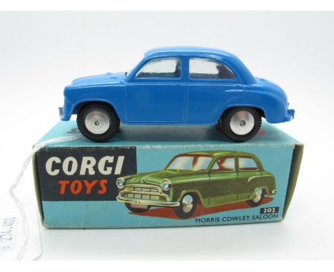 A Boxed Original Corgi #202 Morris Cowley Saloon, blue body, flat spun hubs, no suspension, silver detailing. Model is mint, 