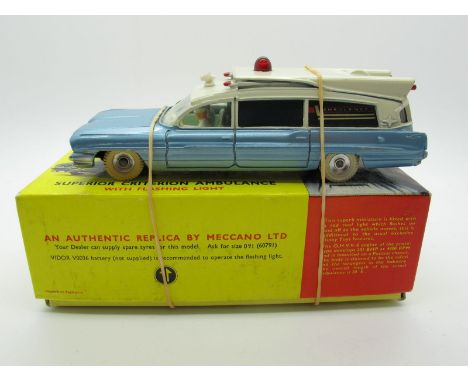 A Boxed Original Dinky #277 Superior Criterion Ambulance, with flashing light, metallic body, white roof and tyres, spun hubs
