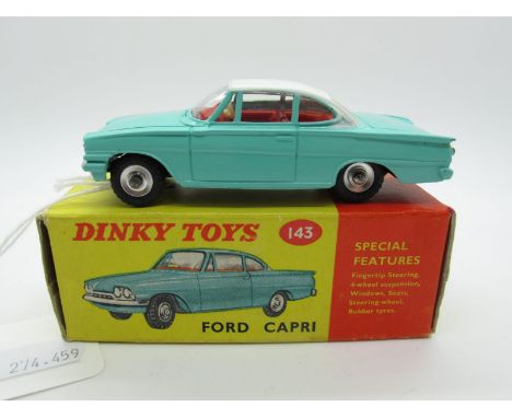A Boxed Original Dinky #143 Ford Capri, turquoise body, white roof, red interior, spun hubs. Model is very near mint. Box goo