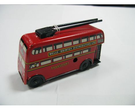 A Small Scale Wells Transport Trolley Bus, clockwork. Plastic wheels. Overall very good., 11cms long.