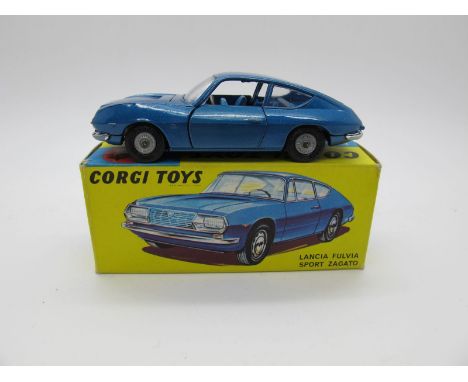 A Boxed Original Corgi #332 Lancia Fulvia Zagato, metallic blue body, light blue interior. Cast detail hubs, jeweled headlamp