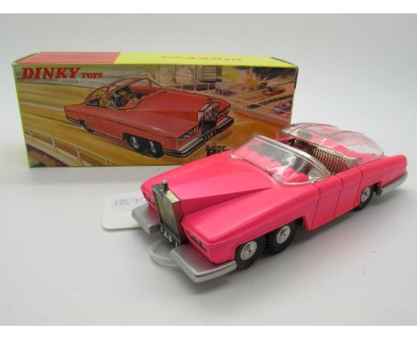 A Boxed Original Dinky #100 Lady Penelope's Fab 1, fluorescent pink body, cast ridged hub, chromed silver interiors, Parker a