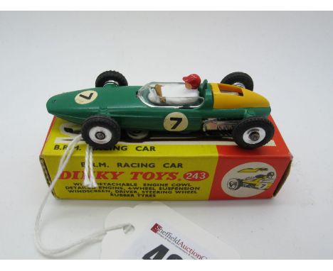 A Boxed Original Dinky #243 B.R.M. Racing Car, dark green body and base, yellow plastic removable engine  cowl, spun hubs, R.