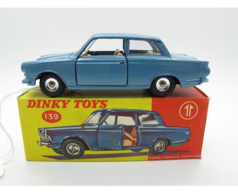 A Boxed Original Dinky #139 Ford Consul Cortina, metallic blue body, fawn interior, spun hubs. Model is mint. Box very good.