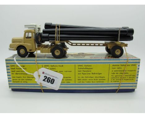 A Boxed Original French Dinky #893 Unic Sahara Pipe Transporter, beige body, white roof, beige convex and concave hubs, six t