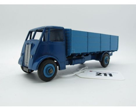 An Original Dinky #511 Guy Four Ton Lorry, unusual colourway 1st type dark blue cab and chassis, mid blue back and grooved hu