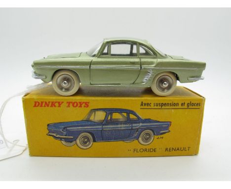 A Boxed Original French Dinky #543 Renault Floride, metallic green body, spun hubs, silver details. Model is mint - some fact