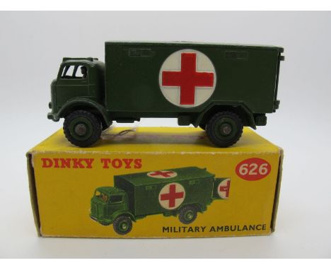 A Boxed Original Dinky #626 Military Ambulance, olive drab body, red crosses cast in, no windows, olive drab hubs. Model very