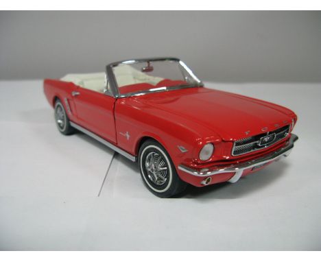 A Boxed Franklin Mint 1:24th Scale Die Cast 1964 1/2 Ford Mustang, highly detailed model in red with white interior. Model is