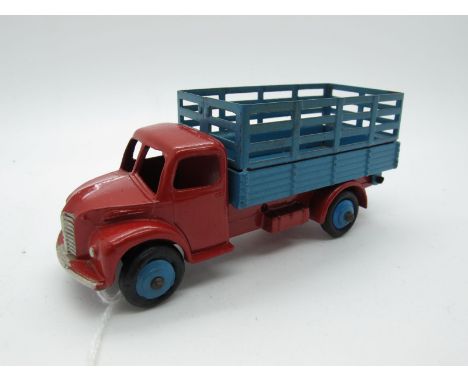 An Original Dinky #3ON Dodge Farm Produce Wagon, red body, blue staked back and hubs, hook. Model fair with minor chips to ra