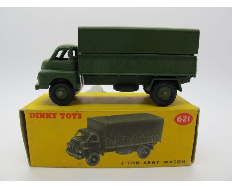 A Boxed Original Dinky #621 Three Ton Army Wagon, olive drab body, tin tilt,driver in, no windows, olive drab hubs. Model goo