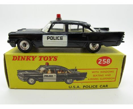 A Boxed Original Dinky #258 U.S.A. Police Car Desoto Fireflite, black body, chrome hubs, white front doors. 'Police' one door