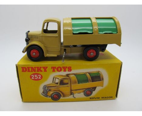 A Boxed Original Dinky #252 Bedford Refuse Wagon, tan body, green shutters, red hubs, no glazing. Model is mint. Box very goo
