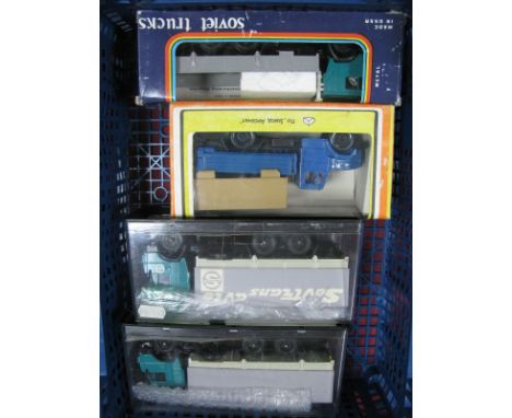 Four Boxed And Cased Russian Made 1:43rd scale Diecast And Plastic Trucks. Kamaz 53212, 10 wheel rigid with tilt, Kamaz 53212