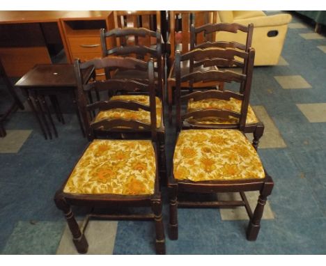 A Set of Four Ladder Back Dining Chairs 